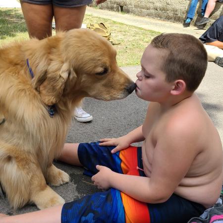 SCAMPer kissing dog